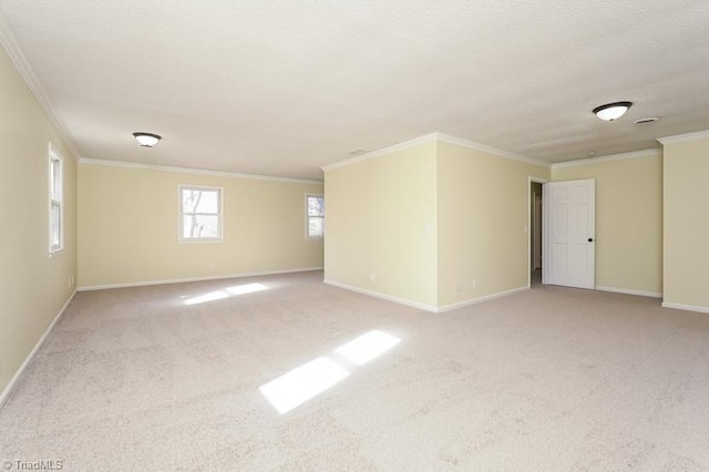 carpeted spare room featuring ornamental molding