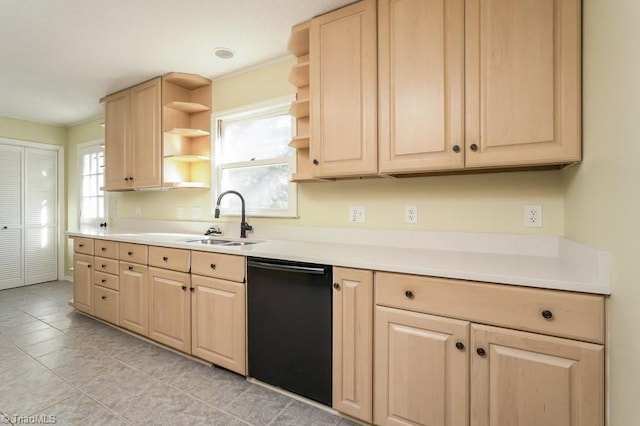 kitchen with sink, black dishwasher, and light brown cabinets