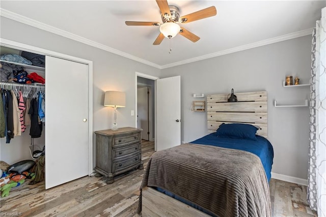 5215 Hicone Rd, Mcleansville, NC 27301 - bedroom with wood finished floors, ornamental molding, a closet, and ceiling fan