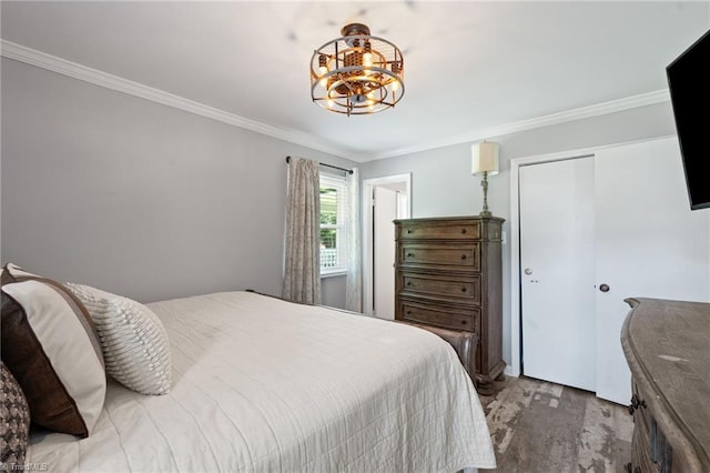 5215 Hicone Rd, Mcleansville, NC 27301 - bedroom featuring crown molding, a chandelier, a closet, and wood finished floors