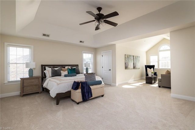 bedroom featuring light carpet, lofted ceiling, and ceiling fan