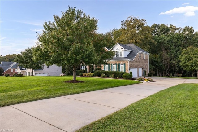 8602 Yvonne Ct, Oak Ridge, NC 27310 - view of front of property with concrete driveway, a garage, a front lawn, and brick siding