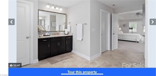 7464 Albemarle Ct, Denver, NC 28037 - ensuite bathroom with vanity, a ceiling fan, and tile patterned flooring