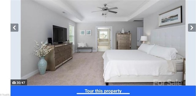 7464 Albemarle Ct, Denver, NC 28037 - bedroom featuring carpet flooring, a tray ceiling, and ensuite bathroom