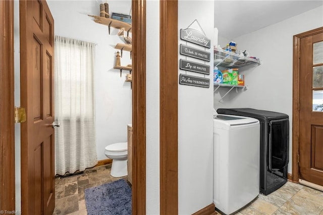 1705 Braemore Ct, Kernersville, NC 27284 - clothes washing area featuring separate washer and dryer, laundry area, stone finish floor, and a wealth of natural light