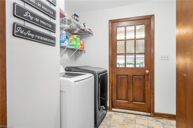 1705 Braemore Ct, Kernersville, NC 27284 - laundry area featuring baseboards, laundry area, stone finish flooring, and independent washer and dryer