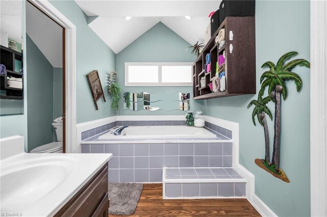 1705 Braemore Ct, Kernersville, NC 27284 - full bath with a bath, wood finished floors, vanity, toilet, and lofted ceiling