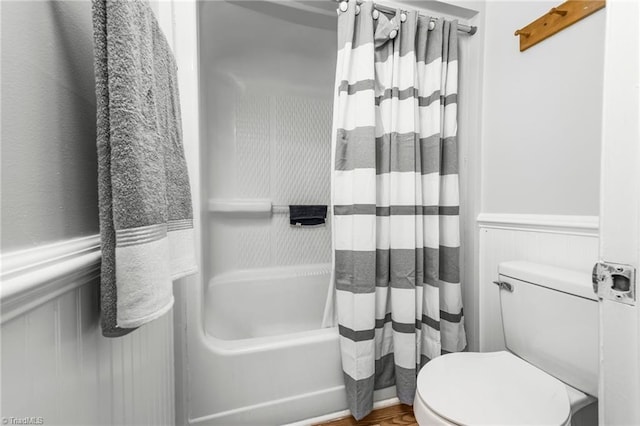 1705 Braemore Ct, Kernersville, NC 27284 - bathroom with a wainscoted wall, shower / bath combo with shower curtain, and toilet