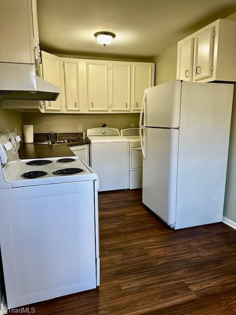 laundry area with independent washer and dryer, dark hardwood / wood-style flooring, and sink