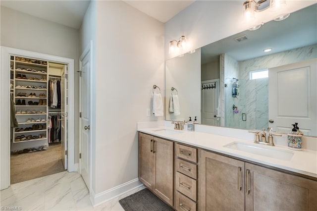 bathroom featuring an enclosed shower and vanity