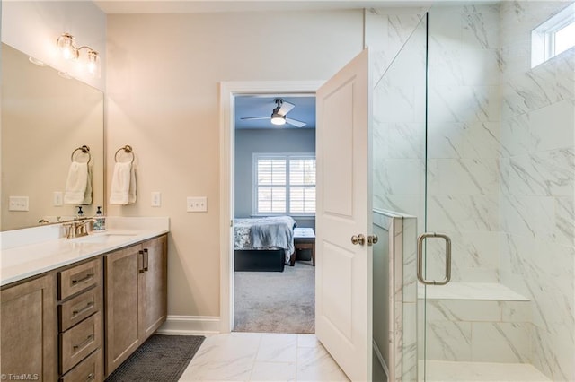 bathroom with ceiling fan, vanity, and an enclosed shower