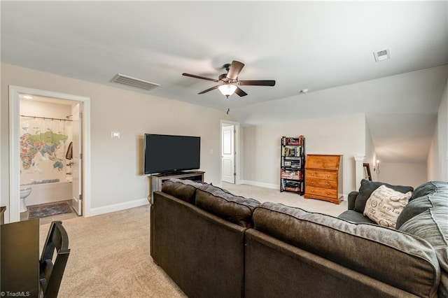 carpeted living room featuring ceiling fan