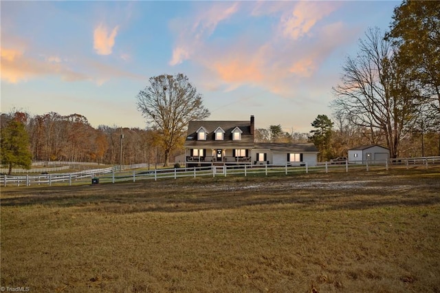 exterior space featuring a yard and a rural view