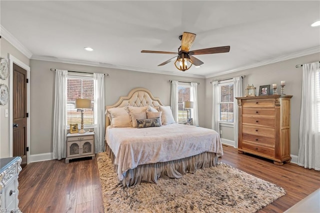 bedroom featuring multiple windows, ceiling fan, dark hardwood / wood-style flooring, and crown molding