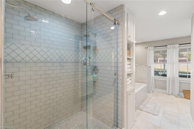 bathroom featuring plus walk in shower