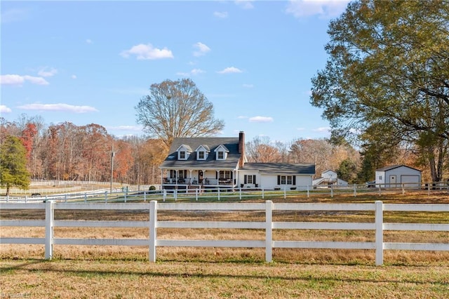 view of front of home with a rural view