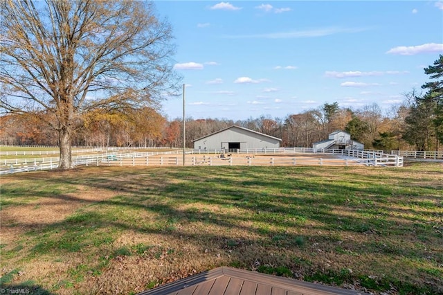 view of yard with a rural view