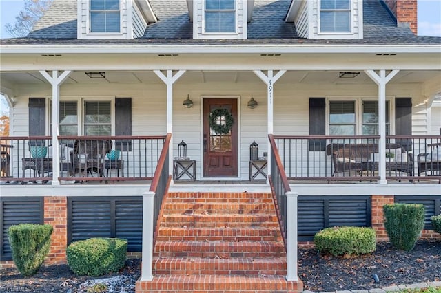 doorway to property featuring covered porch