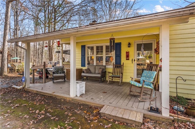 wooden terrace featuring a porch