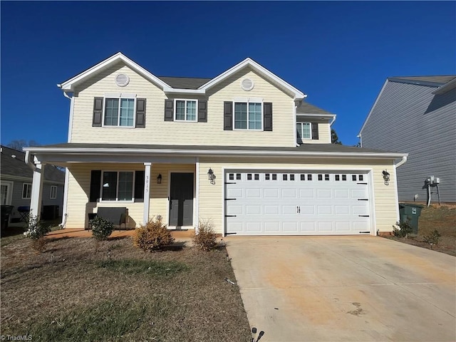 front facade featuring covered porch and a garage