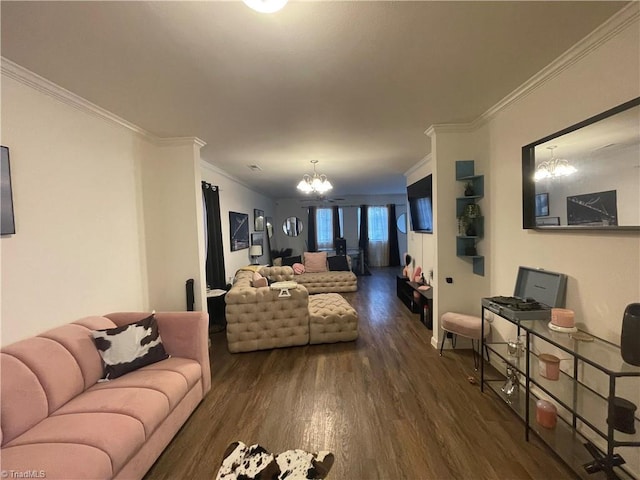 living room with an inviting chandelier, ornamental molding, and dark hardwood / wood-style flooring