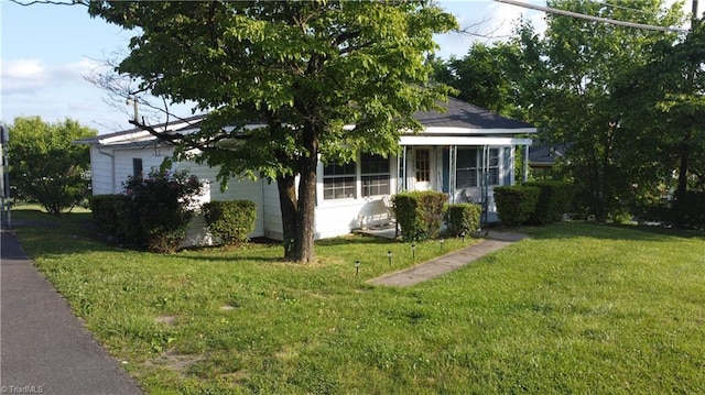 1406 E Pine St, Mount Airy, NC 27030 - view of front of house featuring a front yard and a sunroom