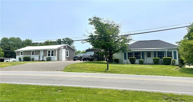 1406 E Pine St, Mount Airy, NC 27030 - single story home featuring asphalt driveway and a front lawn