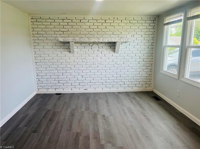 1406 E Pine St, Mount Airy, NC 27030 - empty room featuring baseboards, dark wood-style flooring, and healthy amount of natural light