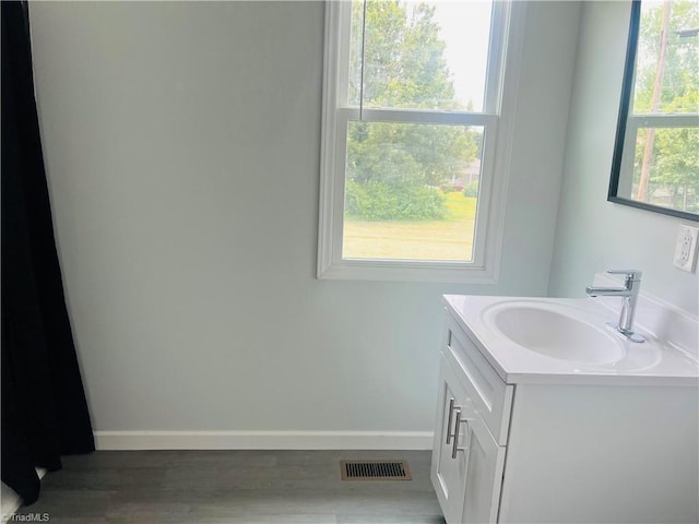 1406 E Pine St, Mount Airy, NC 27030 - bathroom with vanity, baseboards, and wood finished floors