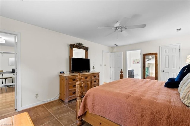 573 Doe Run Dr, Kernersville, NC 27284 - tiled bedroom featuring baseboards, ensuite bath, and a ceiling fan