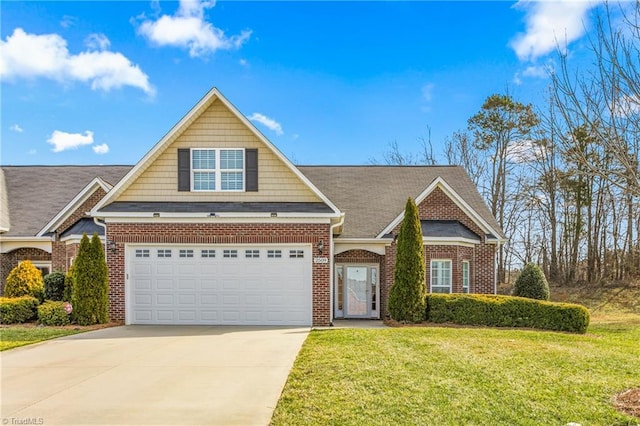 view of front facade with a front lawn, concrete driveway, and brick siding