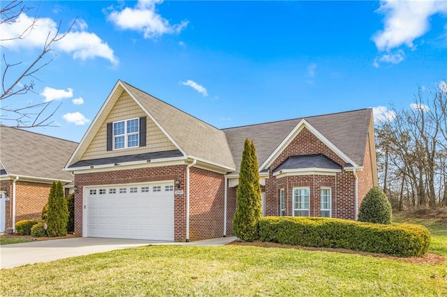 traditional-style house featuring an attached garage, a front lawn, concrete driveway, and brick siding