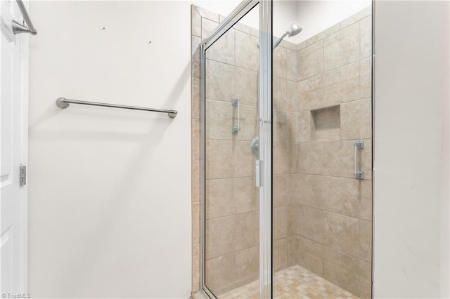 full bathroom featuring a shower stall