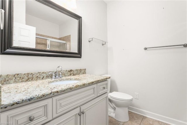 full bathroom featuring baseboards, toilet, tile patterned floors, an enclosed shower, and vanity