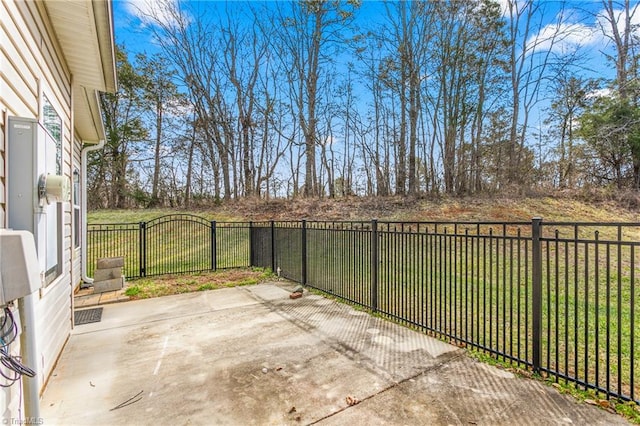 view of patio / terrace featuring fence and a gate