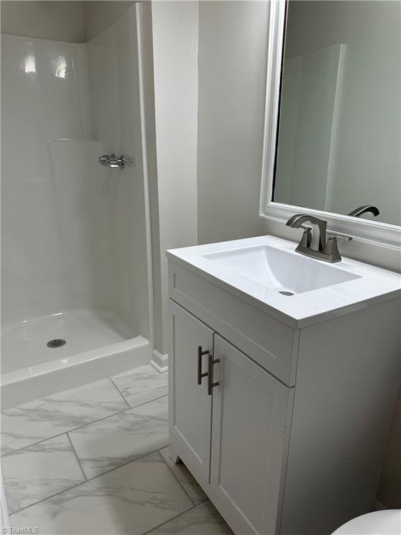 bathroom with vanity and walk in shower