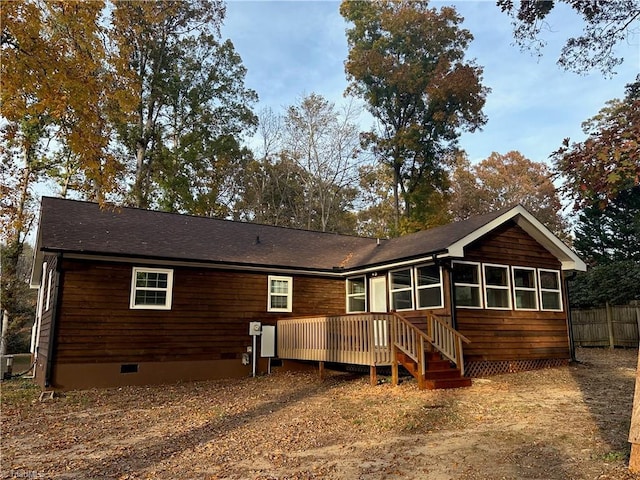 back of house featuring a deck