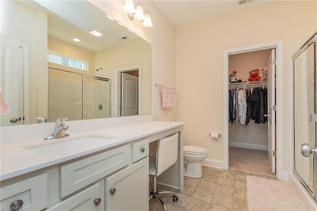 1837 Deveron Ct, Kernersville, NC 27284 - bathroom featuring a stall shower, vanity, and a spacious closet