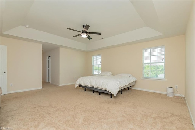 1837 Deveron Ct, Kernersville, NC 27284 - bedroom featuring a raised ceiling, light colored carpet, and multiple windows