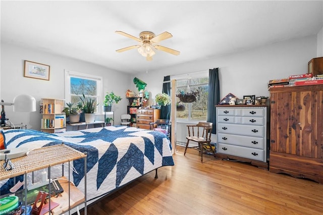 bedroom featuring ceiling fan and light hardwood / wood-style flooring