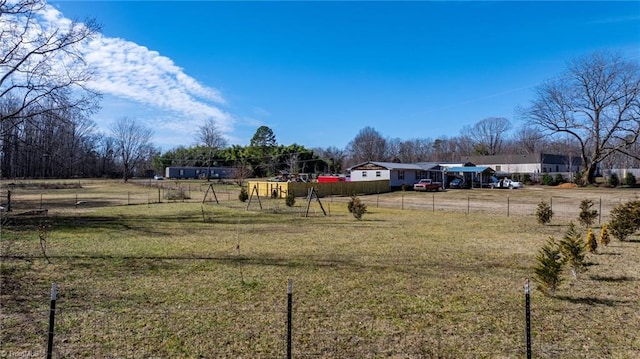 view of yard with a rural view