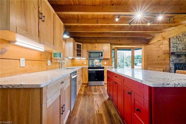 kitchen with appliances with stainless steel finishes, wooden ceiling, dark wood-style floors, a sink, and beam ceiling