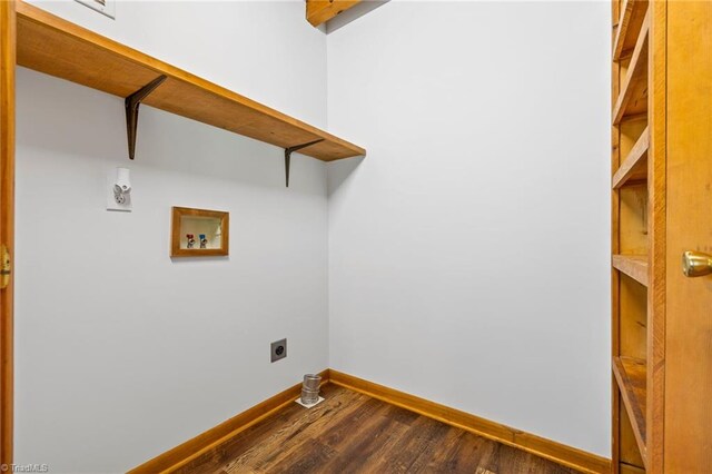 laundry room with hookup for a washing machine, electric dryer hookup, baseboards, and dark wood-style flooring