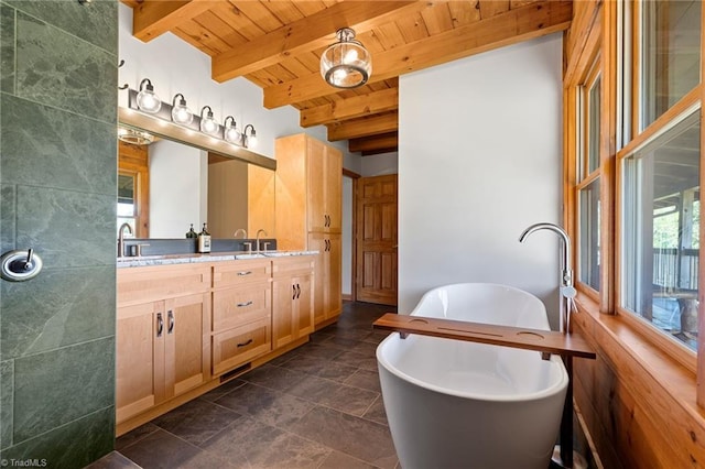 full bathroom featuring wooden ceiling, double vanity, a soaking tub, and beamed ceiling