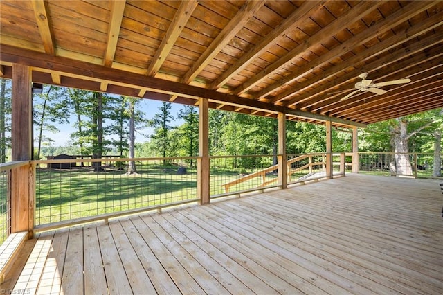 deck with a lawn and view of scattered trees