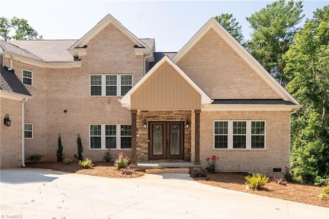 128 Provence Ct, King, NC 27021 - view of front of home featuring french doors, board and batten siding, brick siding, and crawl space