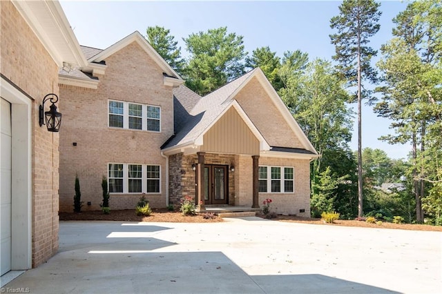 128 Provence Ct, King, NC 27021 - view of front of house featuring brick siding, board and batten siding, and roof with shingles