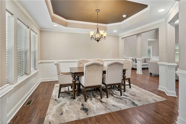 128 Provence Ct, King, NC 27021 - dining room featuring a tray ceiling, a chandelier, crown molding, wood finished floors, and wainscoting