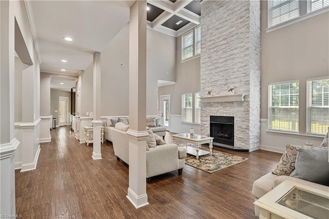 128 Provence Ct, King, NC 27021 - living room featuring a high ceiling, dark wood-style flooring, a fireplace, beam ceiling, and recessed lighting