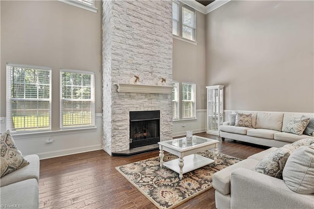 128 Provence Ct, King, NC 27021 - living area with a high ceiling, a fireplace, hardwood / wood-style floors, and crown molding
